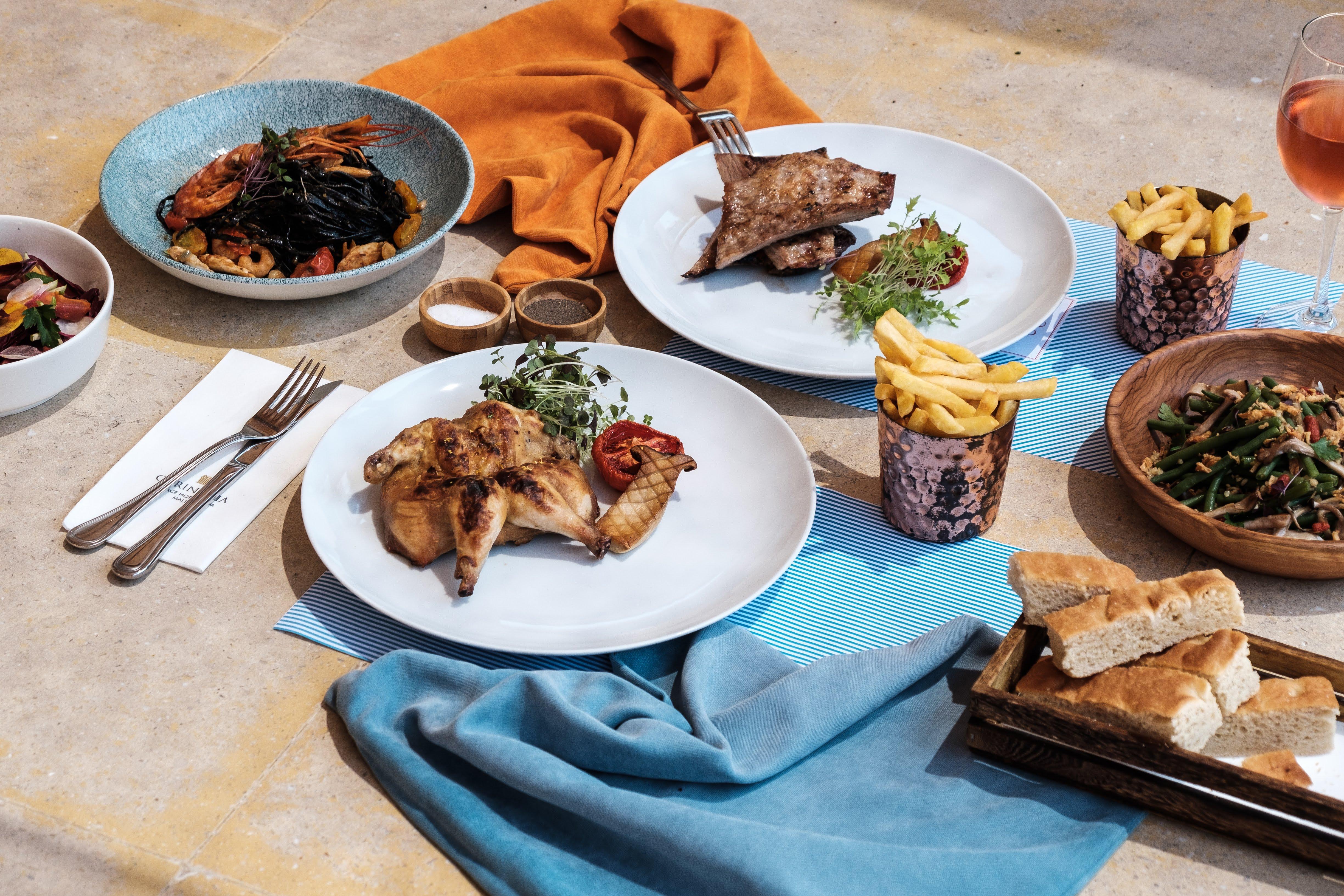 Corinthia Palace Malta Attard Exteriör bild A selection of dishes from the restaurant